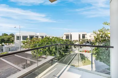 an apartment balcony with a view of a street at Gorgeous 3BR Townhouse with Private Garden in Dubai
