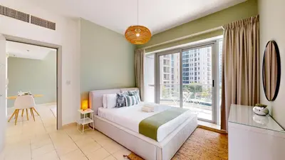 a bedroom with a bed and a large window at The Point Tower - Vibrant One Bed in Marina in Dubai
