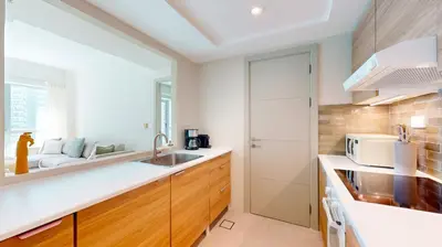 a kitchen with a sink and a microwave at The Point Tower - Vibrant One Bed in Marina in Dubai