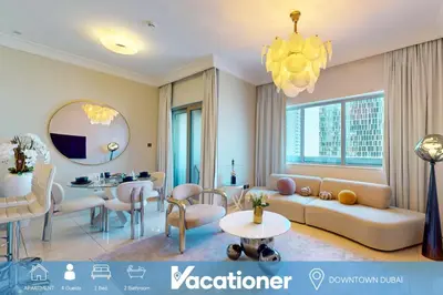 a living room with a couch and a table at The Signature - Two Bedroom in Downtown Dubai in Dubai