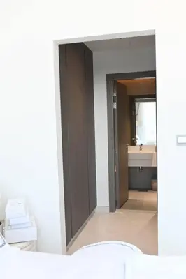 a bathroom with a sink and a toilet and a mirror at 610 lagoon views in Dubai