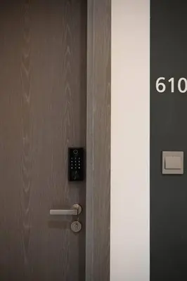 a close up of a wooden door with a lock at 610 lagoon views in Dubai