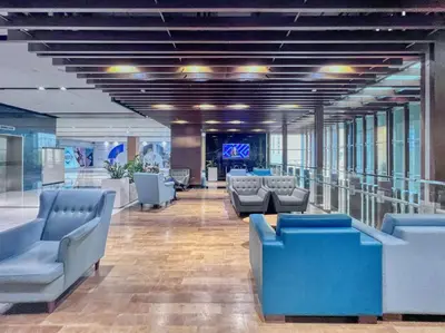 a lobby with couches and chairs in a building at FIRST CLASS 1BR Luxurious DIFC Retreat in Dubai