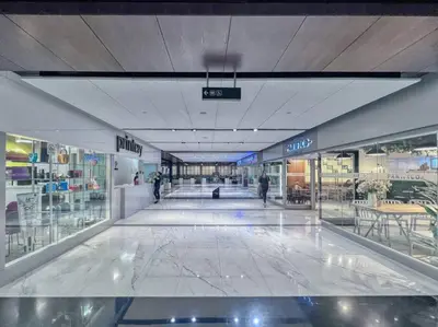 a large shopping mall with people walking in it at FIRST CLASS 1BR Luxurious DIFC Retreat in Dubai
