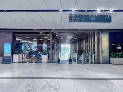 an empty lobby of an airport with tables and chairs at FIRST CLASS 1BR Luxurious DIFC Retreat in Dubai