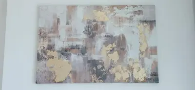 a close up of a painting on a wall at Bright & Cozy 1br Jvc Balcony Free Parking in Dubai