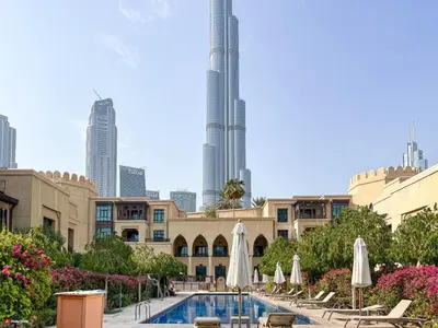 a view of the burj khalifa from a hotel with a pool at Souk Al Bahar Home with direct Dubai Mall Access in Dubai