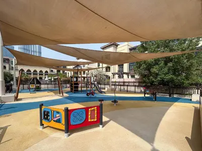 a playground with a play equipment under a canopy at Souk Al Bahar Home with direct Dubai Mall Access in Dubai
