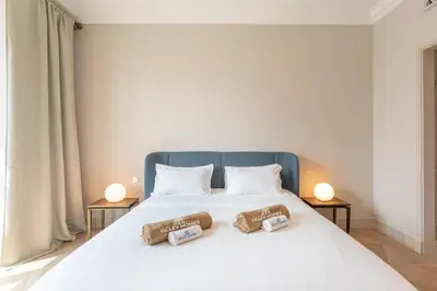 a bedroom with a bed with two towels on it at Souk Al Bahar Home with direct Dubai Mall Access in Dubai