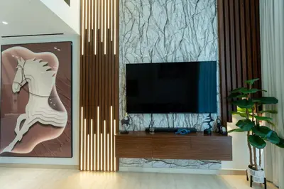 a living room with a tv with a horse on it at Chic Comfort - Stylish One-Bedroom in Dubai