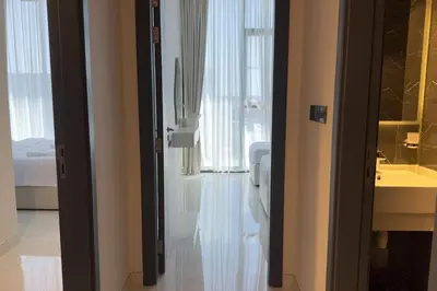 a bathroom with a toilet and a sink at Relaxing 2BR Escape with Private Pool Samana GA by Vibel in Dubai