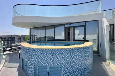 a swimming pool on the roof of a house at Relaxing 2BR Escape with Private Pool Samana GA by Vibel in Dubai