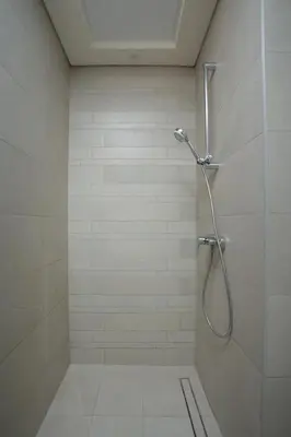 a shower with a glass door in a bathroom at Nasma Luxury Stays - Cozy Urban Studio at Azizi Riviera 43 in Meydan in Dubai