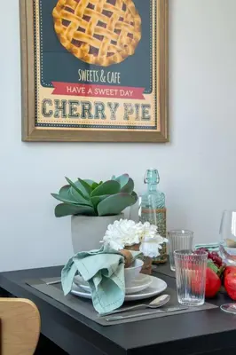 a table with a picture of a waffle at Frank Porter - DEC Tower 3 in Dubai
