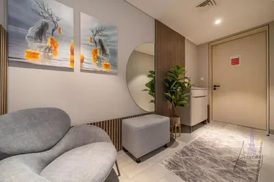 a waiting room with two chairs and a mirror at Luxurious Studio Marina View Condor Marina Star in Dubai