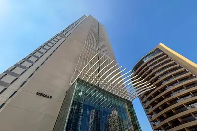 a tall building next to two tall buildings at Frank Porter - The One JBR in Dubai