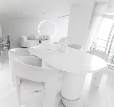 a white room with white sinks and chairs at Luxuriöses Apartment mit Burj Khalifa View in Dubai