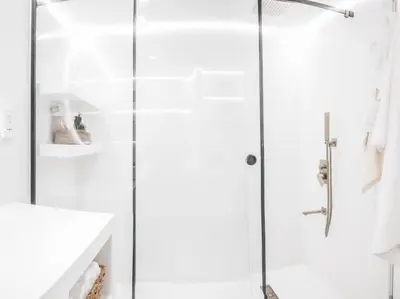 a shower with a glass door in a bathroom at Luxuriöses Apartment mit Burj Khalifa View in Dubai