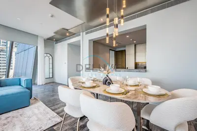 a dining room with a table and chairs at Luxurious 2BR at DAMAC Heights, Dubai Marina by Deluxe Holiday Homes in Dubai