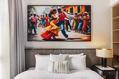 a painting of a dancing couple in a hotel room at Pool side view at Dubai Creek Harbour by DuStay in Dubai