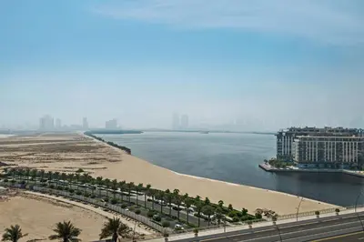 a view of a beach and a body of water at Pool side view at Dubai Creek Harbour by DuStay in Dubai