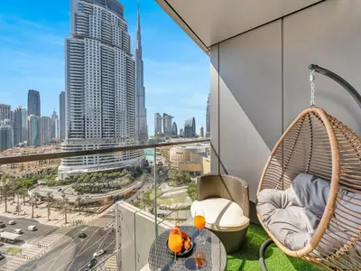 a balcony with a hammock and a view of the city at New! PS5! Burj Khalifa view & Infinity Pool in Dubai