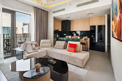 a living room with a couch and a table at Modern Apartment in Dubai Creek Harbour By DuStay in Dubai