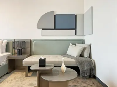 a living room with a couch and a table at Chic and Bright Studio in Meydan in Dubai