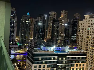 a view of a city skyline at night at Himalaya Holiday Homes 1BHK - Dubai Marina in Dubai