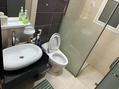 a bathroom with a sink and a toilet and a shower at Himalaya Holiday Homes 1BHK - Dubai Marina in Dubai