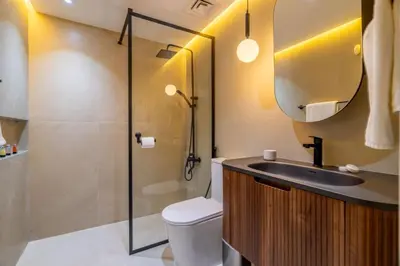 a bathroom with a toilet and a sink and a mirror at GuestReady - Splendid Stay in Dubai Marina in Dubai
