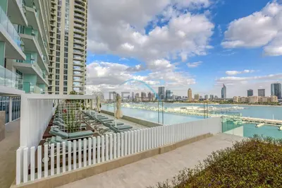 a balcony of a building with a view of the water at Classy 3BR with Assistant Room at Sunrise Bay Tower 1 Emaar Beachfront, Dubai Marina by Deluxe Holiday Homes in Dubai