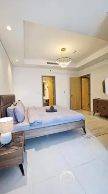 a bedroom with a large bed in a room at Luxury 2BR Midtown Apartment in Dubai