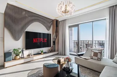 a living room with a couch and a tv at Breathtaking Dubai Skyline view apartment - By DuStay in Dubai