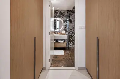 a bathroom with a sink and a mirror at Breathtaking Dubai Skyline view apartment - By DuStay in Dubai
