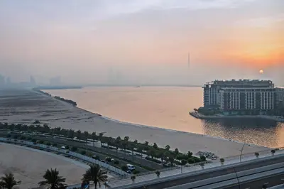 a view of a hotel on the beach with the ocean at Breathtaking Dubai Skyline view apartment - By DuStay in Dubai