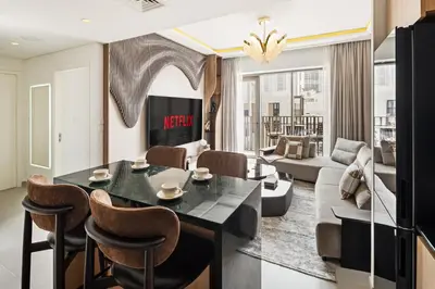 a living room with a table and a couch at Luxury Getaway Apartment at Dubai Creek Harbour - By Dustay in Dubai