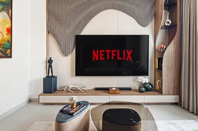 a living room with a netflix sign on a tv screen at Luxury, Spacious Apartment in Dubai Creek Harbour - By DuStay in Dubai