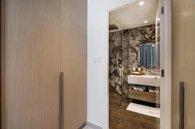 a bathroom with a sink and a mirror at Luxury, Spacious Apartment in Dubai Creek Harbour - By DuStay in Dubai