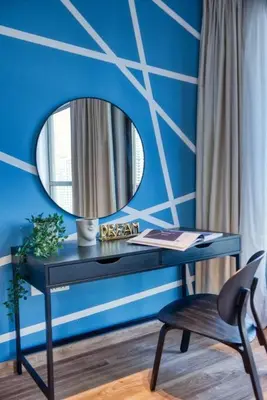 a desk with a mirror and a chair in a room at The Smart Concierge - Bahar 6 in Dubai