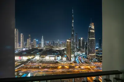 a view of a city at night with traffic at Peaceful Dunes 1 - Burj Khalifa & Dubai Mall in Dubai