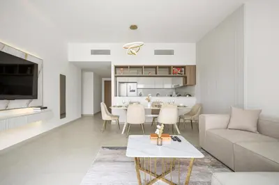 a living room with a couch and a table at Peaceful Dunes 1 - Burj Khalifa & Dubai Mall in Dubai