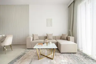 a living room with a couch and a table at Peaceful Dunes 1 - Burj Khalifa & Dubai Mall in Dubai
