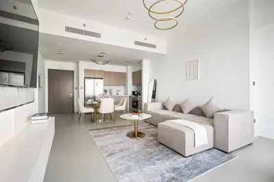 a living room with a couch and a table at Peaceful Dunes 2 - Near Burj Khalifa & Dubai Mall in Dubai