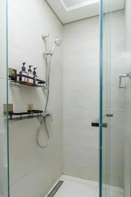 a shower with a glass door in a bathroom at Nasma Luxury Stays - Azizi Riviera 6 Cozy Studio with Burj Khalifa View in Dubai