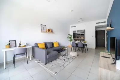 a living room with a couch and a table at Frank Porter - Marina Quays West Tower in Dubai