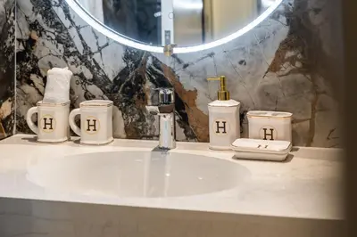 a bathroom with a sink and a mirror at Elegant 2-Bedroom Apartment in Dubai Creek Harbour - By Dustay in Dubai