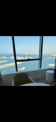 a view of the ocean from a window in an airplane at Gorgeous Palm View in Dubai