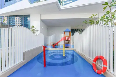 a childrens pool with a playground in a building at Stella Maris, Dubai Marina- Luxurious 1-BR in Dubai