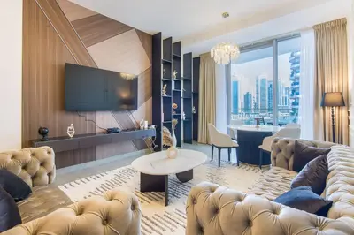 a living room with a couch and a tv at Stella Maris, Dubai Marina- Luxurious 1-BR in Dubai